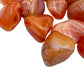 Overhead view of Grade AA Carnelian tumbled stone, from Botswana, linked to Energy and Confidence.