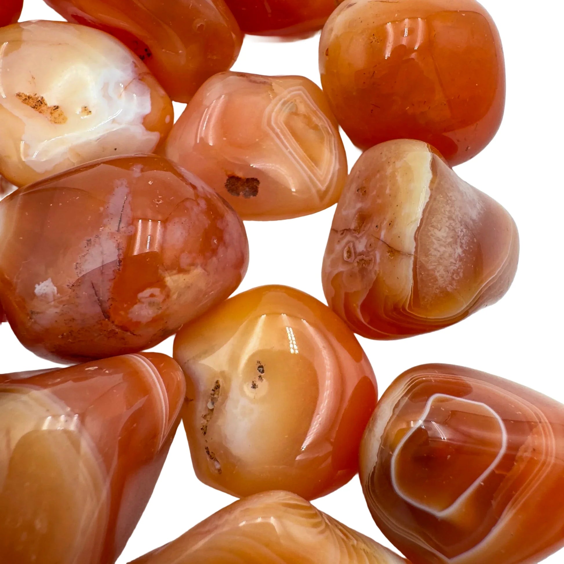 Styled with natural light Carnelian tumbled stone, from Francistown, Botswana, with form visible in context.