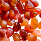 Alternate side of Grade AA Carnelian tumbled stone, for Energy.