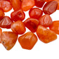 Side profile of Carnelian tumbled stone, sourced from Botswana, for Energy and Confidence.