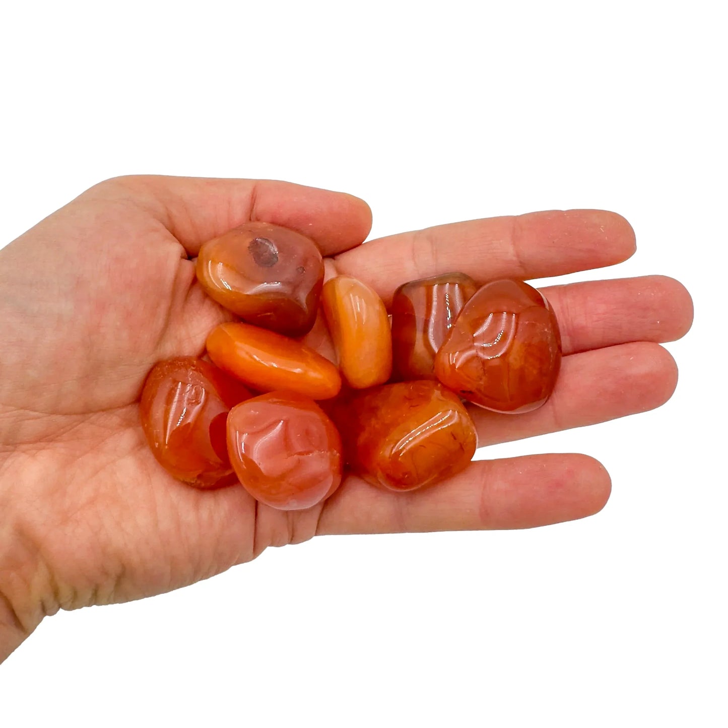 Alternate side of orange Carnelian tumbled stone, often paired with practices around Energy, Botswana-sourced.