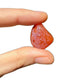 Base detail of Grade AA Carnelian tumbled stone