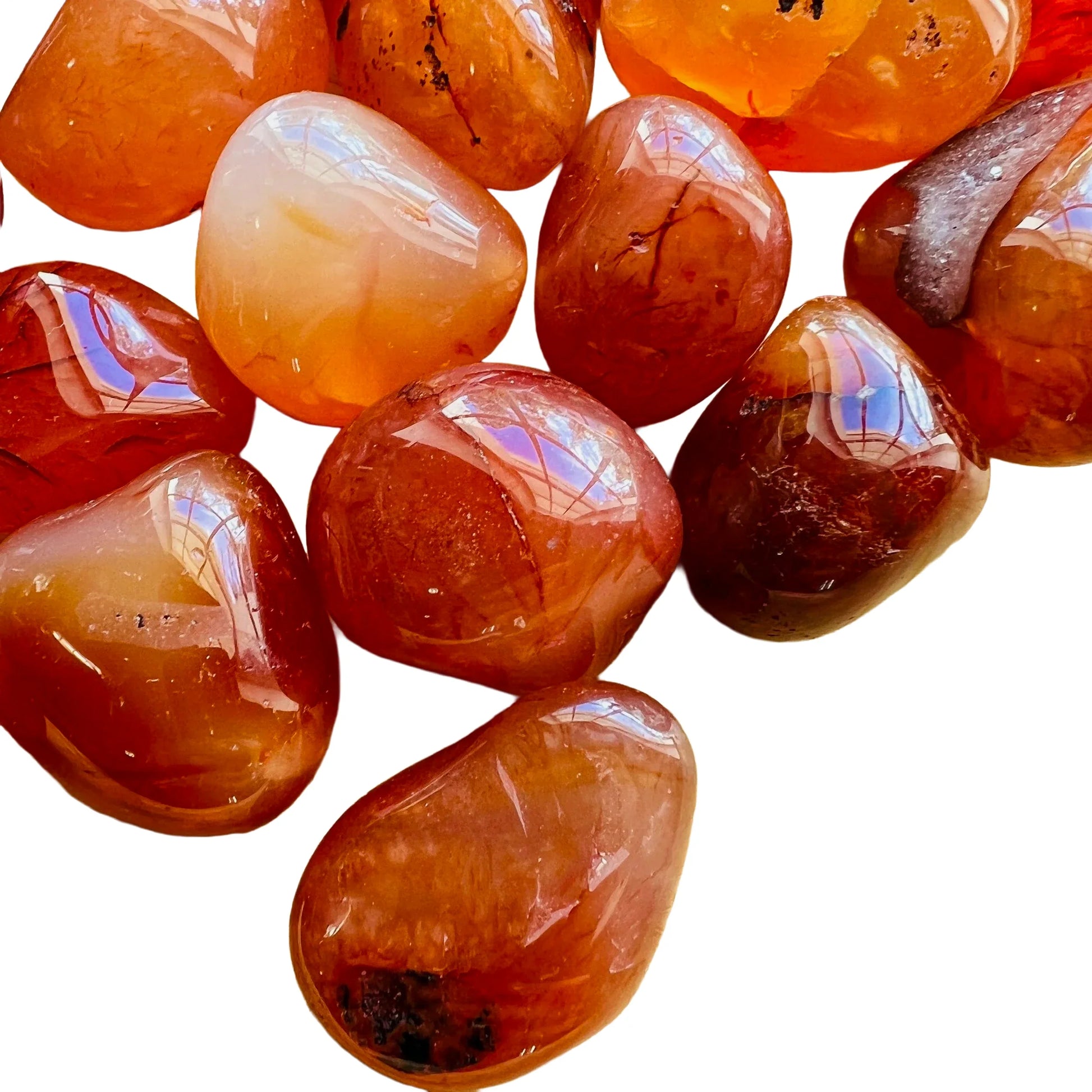 Lateral view of orange Carnelian tumbled stone, Brazil-sourced, showing natural variation.