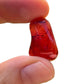 Overhead angle of Carnelian tumbled stone, showing translucent edges, hand-selected from Paraná, Brazil.