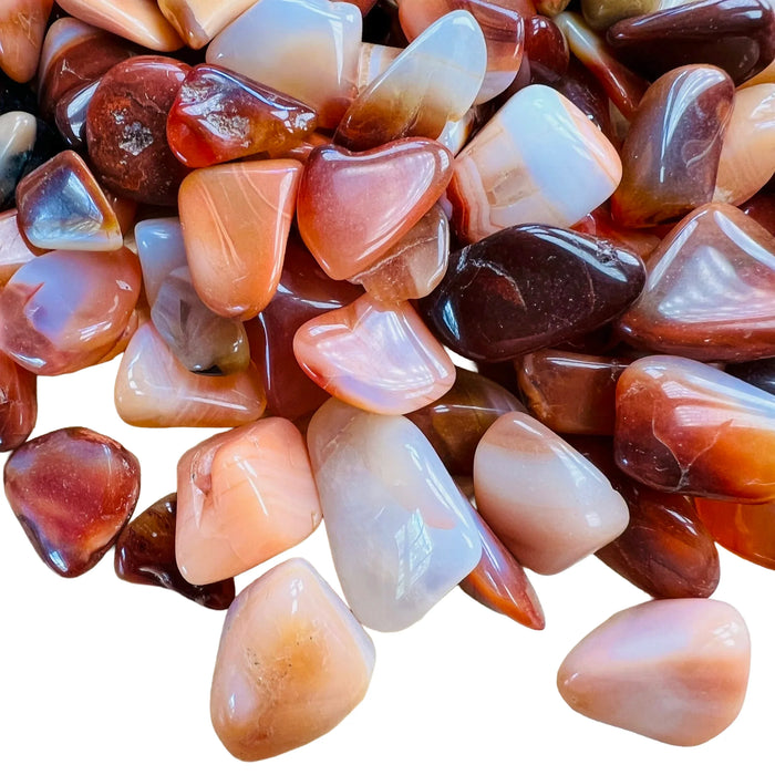 Detail shot showing Carnelian tumbled stone, showing matte finish, from Boeny, Madagascar.