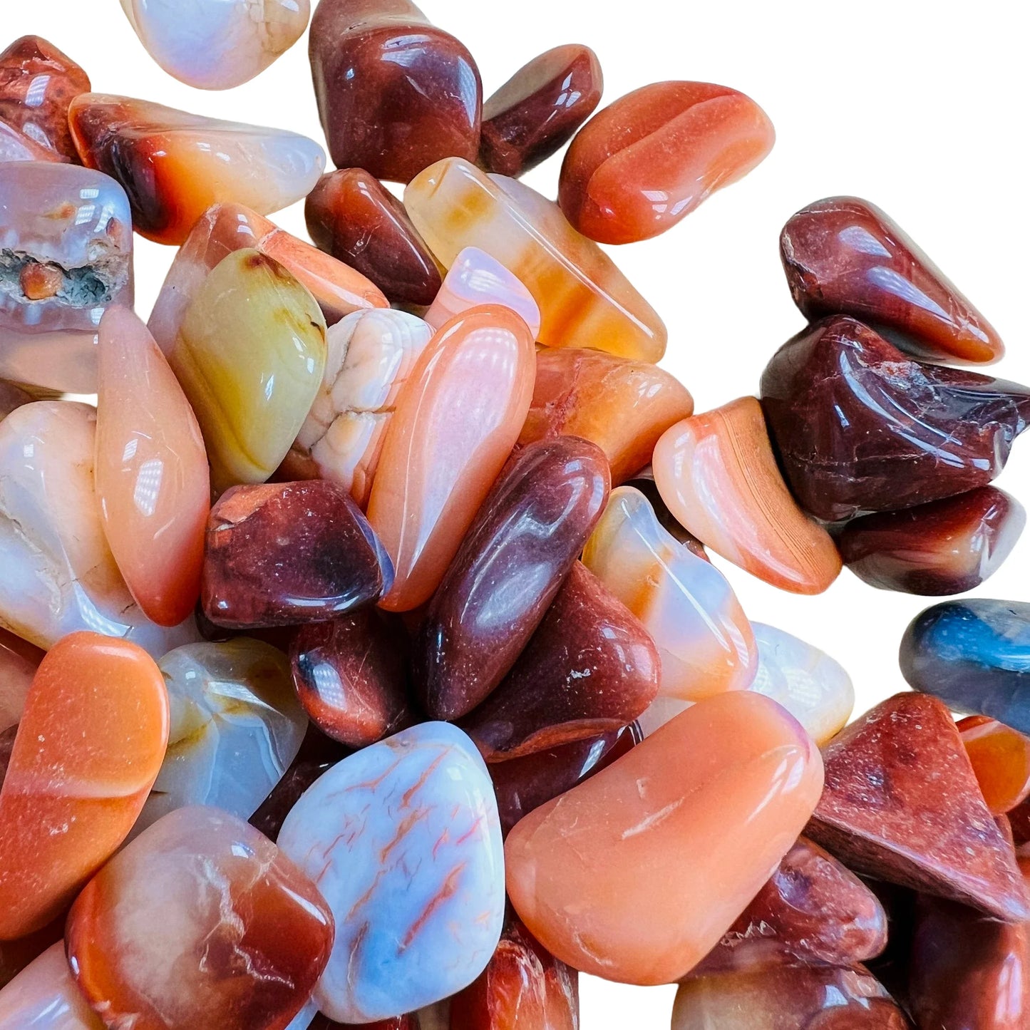 Alternate side of Carnelian tumbled stone, from Madagascar, often paired with practices around Energy.