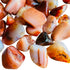 Alternate angle of Carnelian tumbled stone, showing characteristic patterning, from Madagascar.