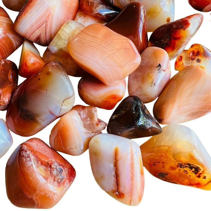 Alternate angle of Carnelian tumbled stone, showing characteristic patterning, from Madagascar.
