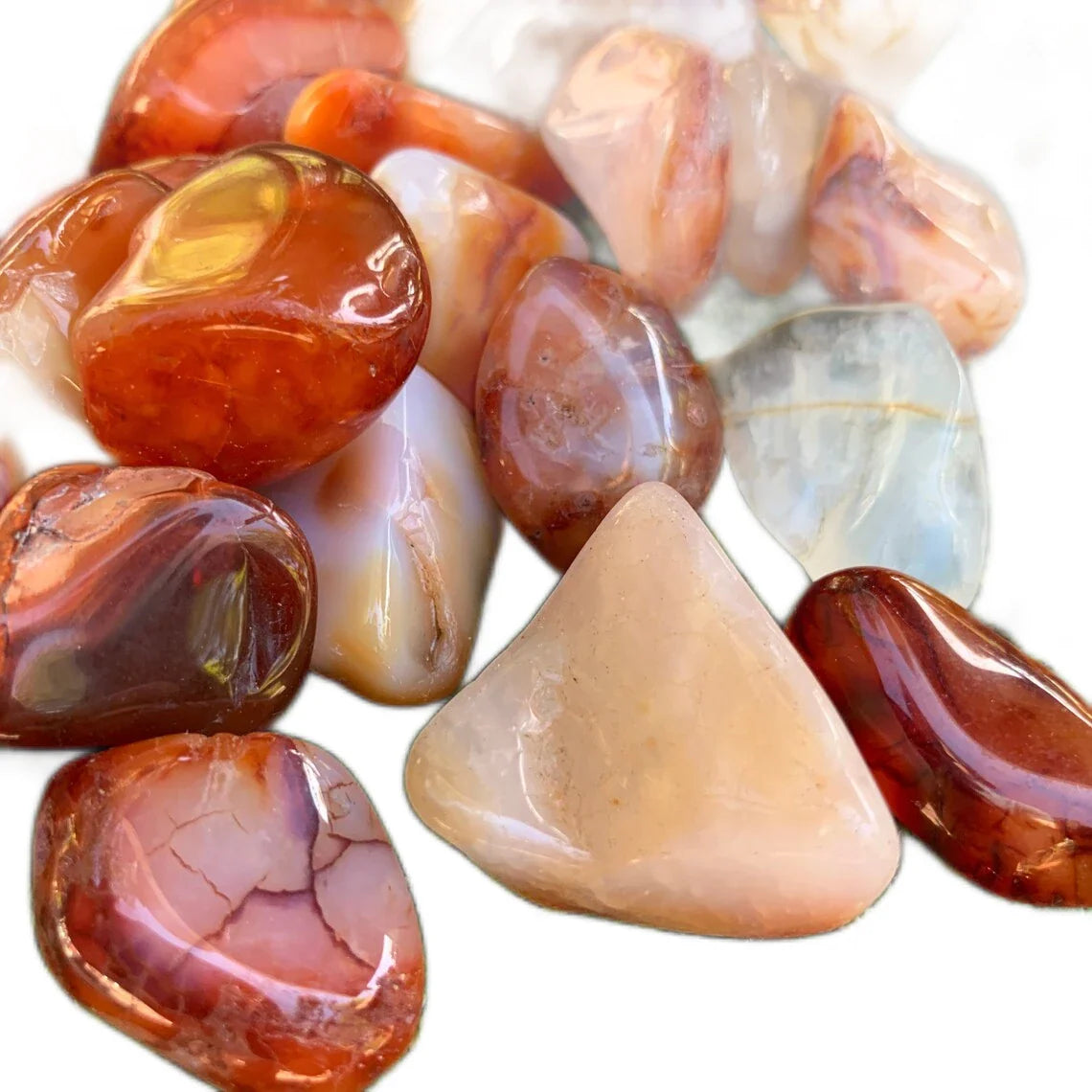 Companion image of Carnelian tumbled stone, from Boeny, Madagascar, with natural details visible.