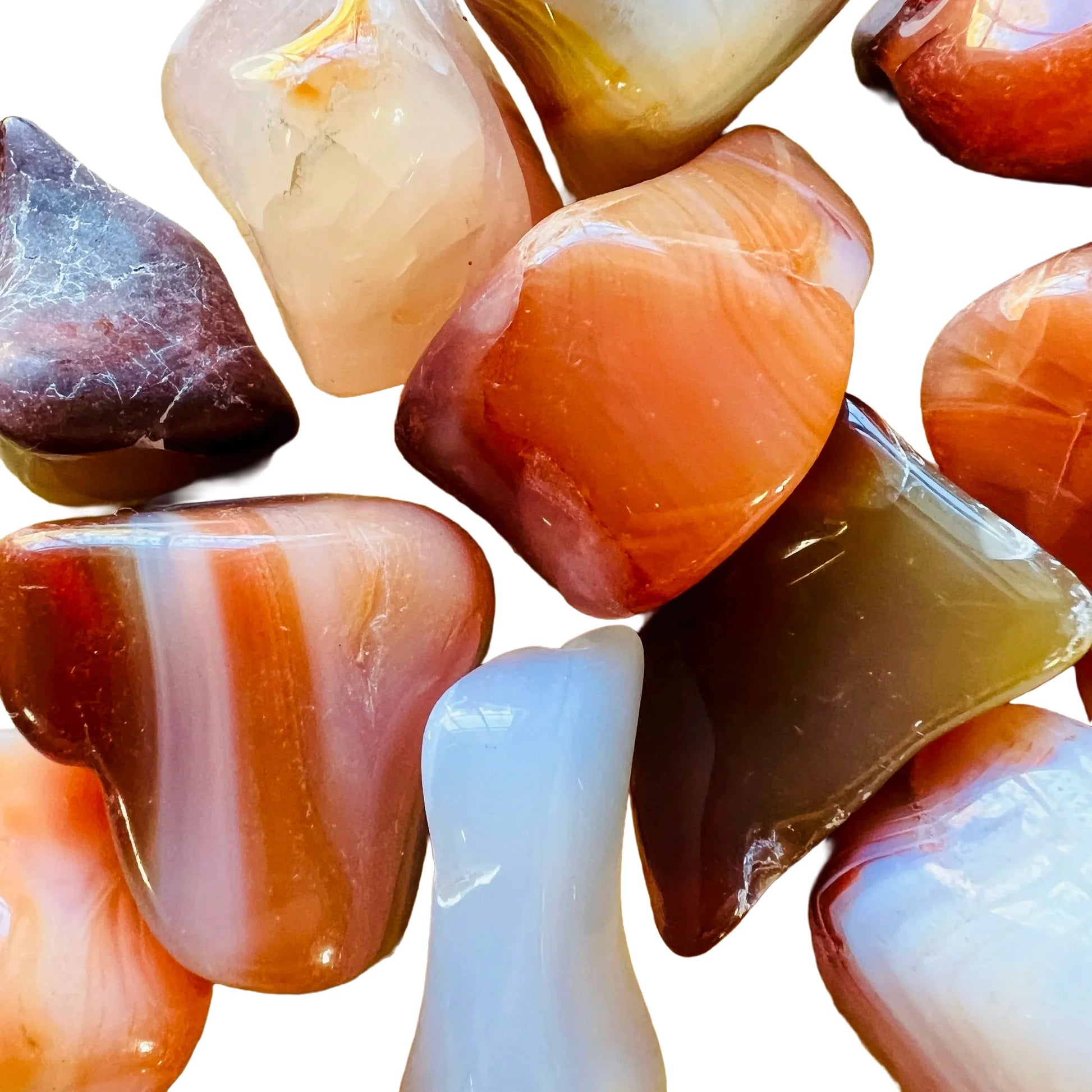 Edge-on view of Carnelian tumbled stone, showing earthy tone.