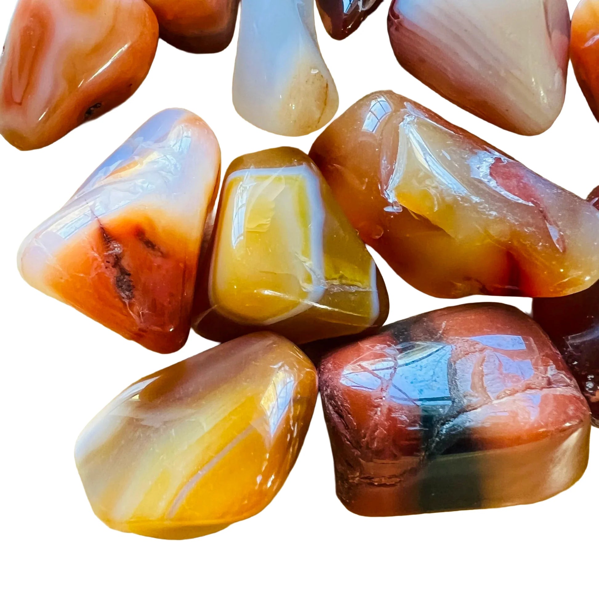 Top angle of Grade AA Carnelian tumbled stone, often paired with practices around Energy, showing natural sheen.