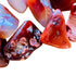 Rear view of orange Carnelian tumbled stone, from Boeny, Madagascar, showing color depth.