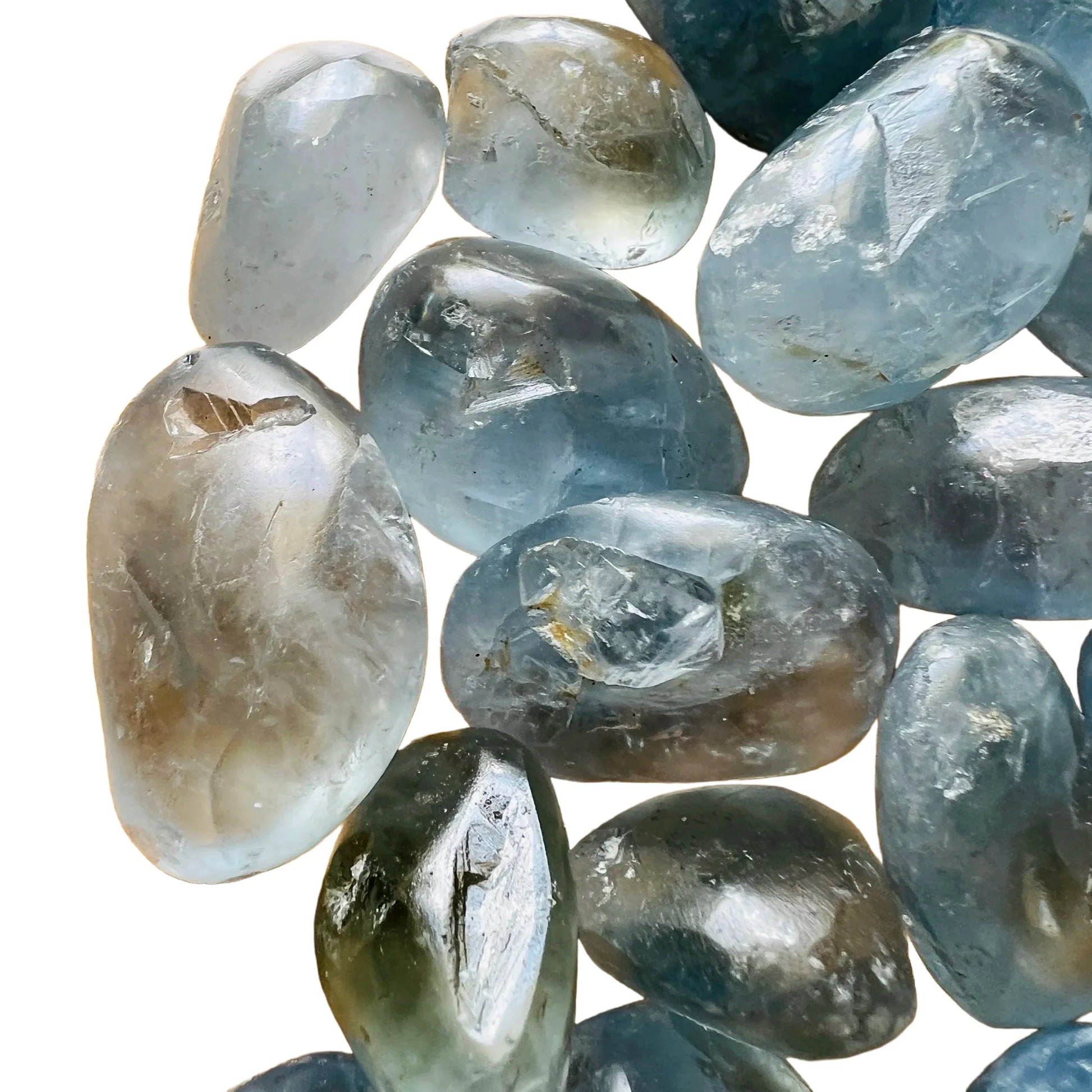 Side-on view of Grade AA Celestite tumbled stone, from Sakoany, Madagascar, traditionally used for Stress Relief and Sleep.