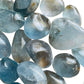 Natural light view of a single Celestite tumbled stone from Madagascar.