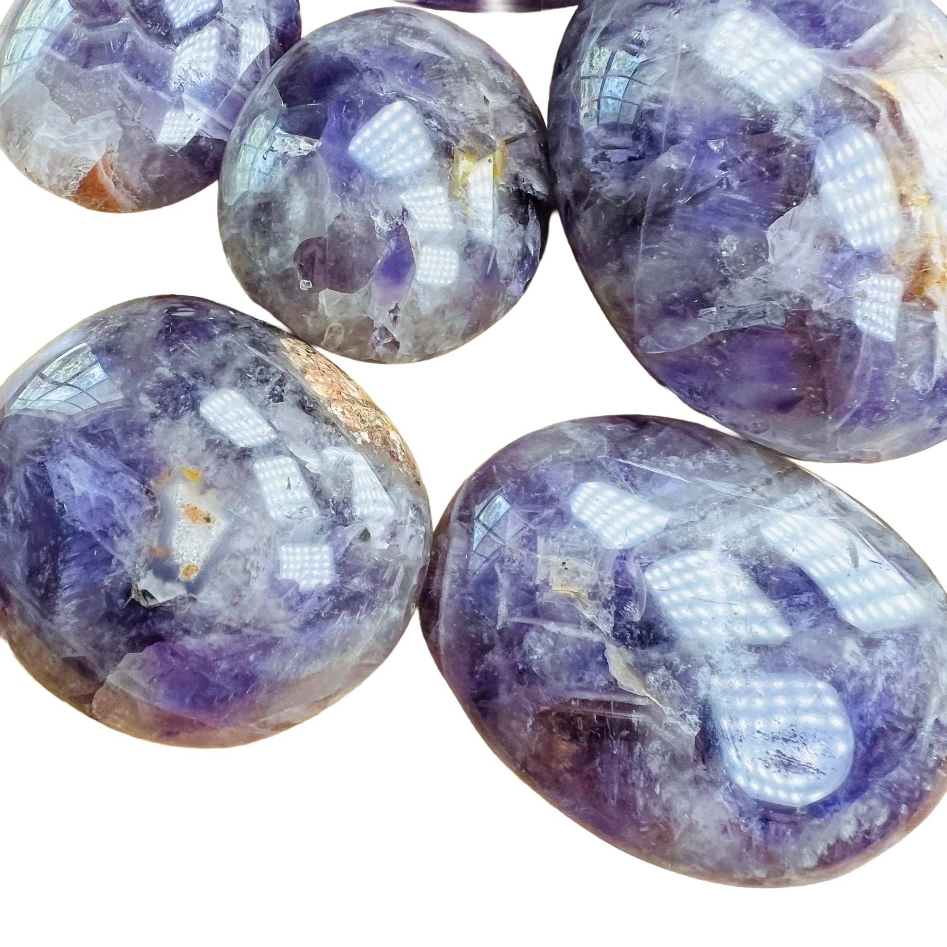 Side profile of Chevron Amethyst palm stone, showing earthy tone, associated with Intuition.