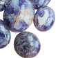 Top-side view of Chevron Amethyst palm stone, from Madagascar.