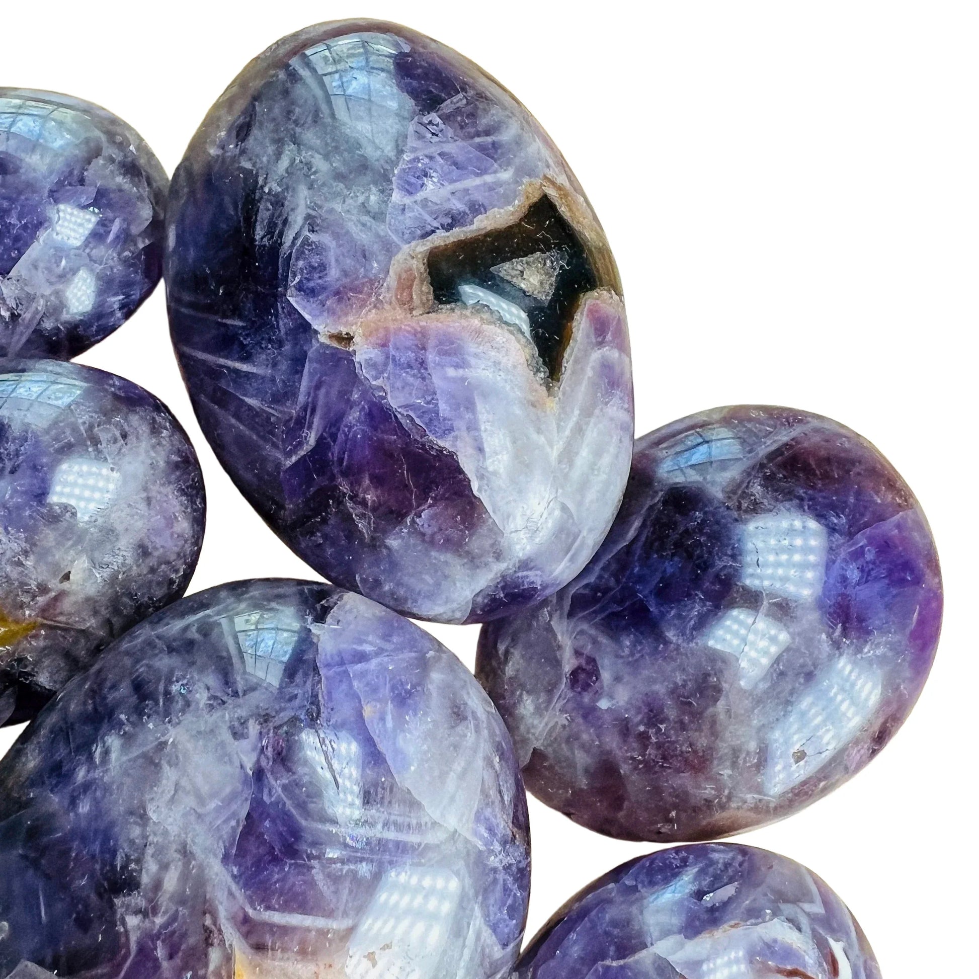 Underside detail of Grade AA Chevron Amethyst palm stone, showing characteristic patterning, linked to Intuition.