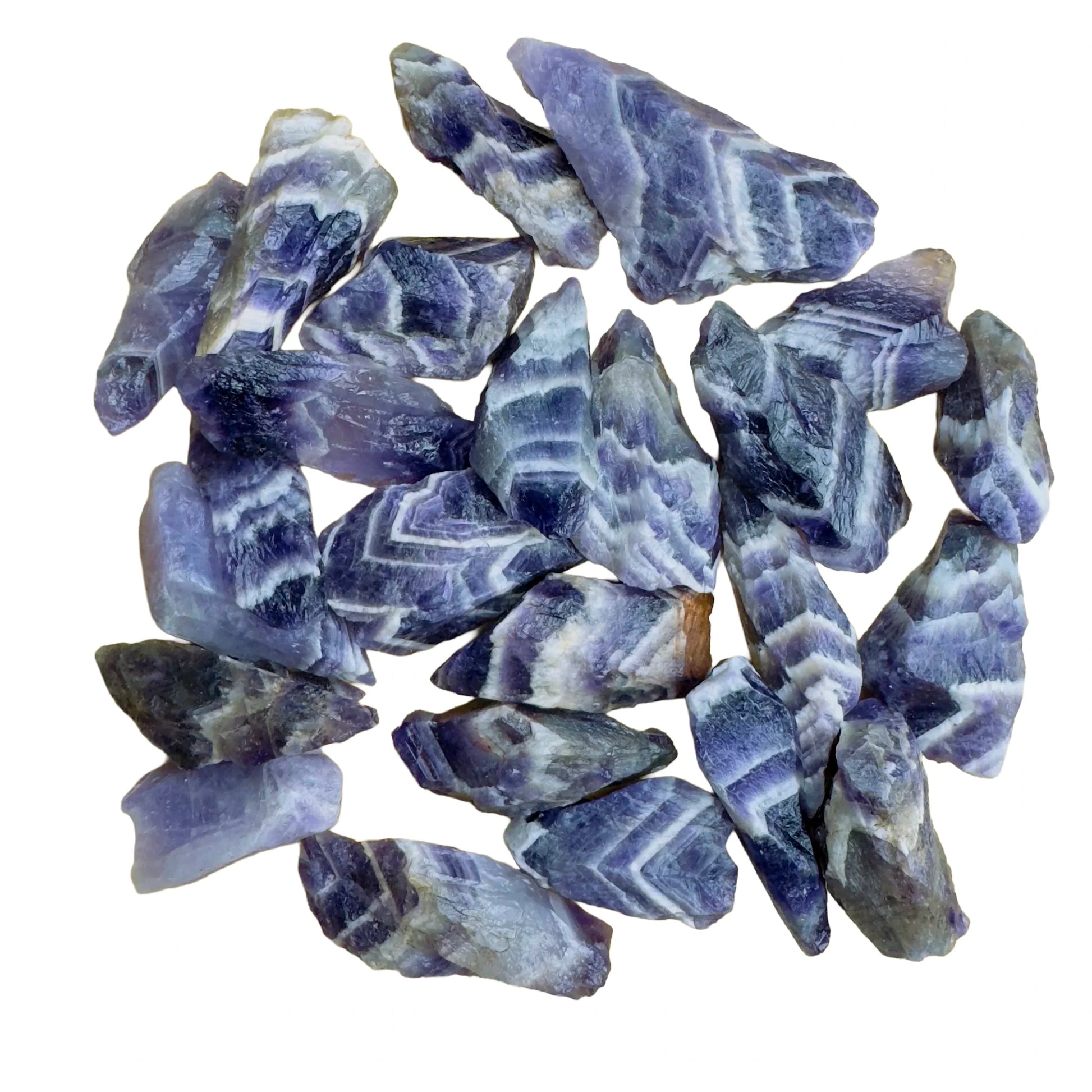 Close detail of purple Chevron Amethyst raw stone, often kept for Intuition and Meditation.