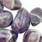Hand-scale view of Chevron Amethyst tumbled stone, from Copperbelt Province, Zambia, associated with Meditation, shown for proportion against the hand.