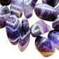 Surface detail of Grade AA purple Chevron Amethyst tumbled stone, kept near for Intuition and Meditation, from Copperbelt.