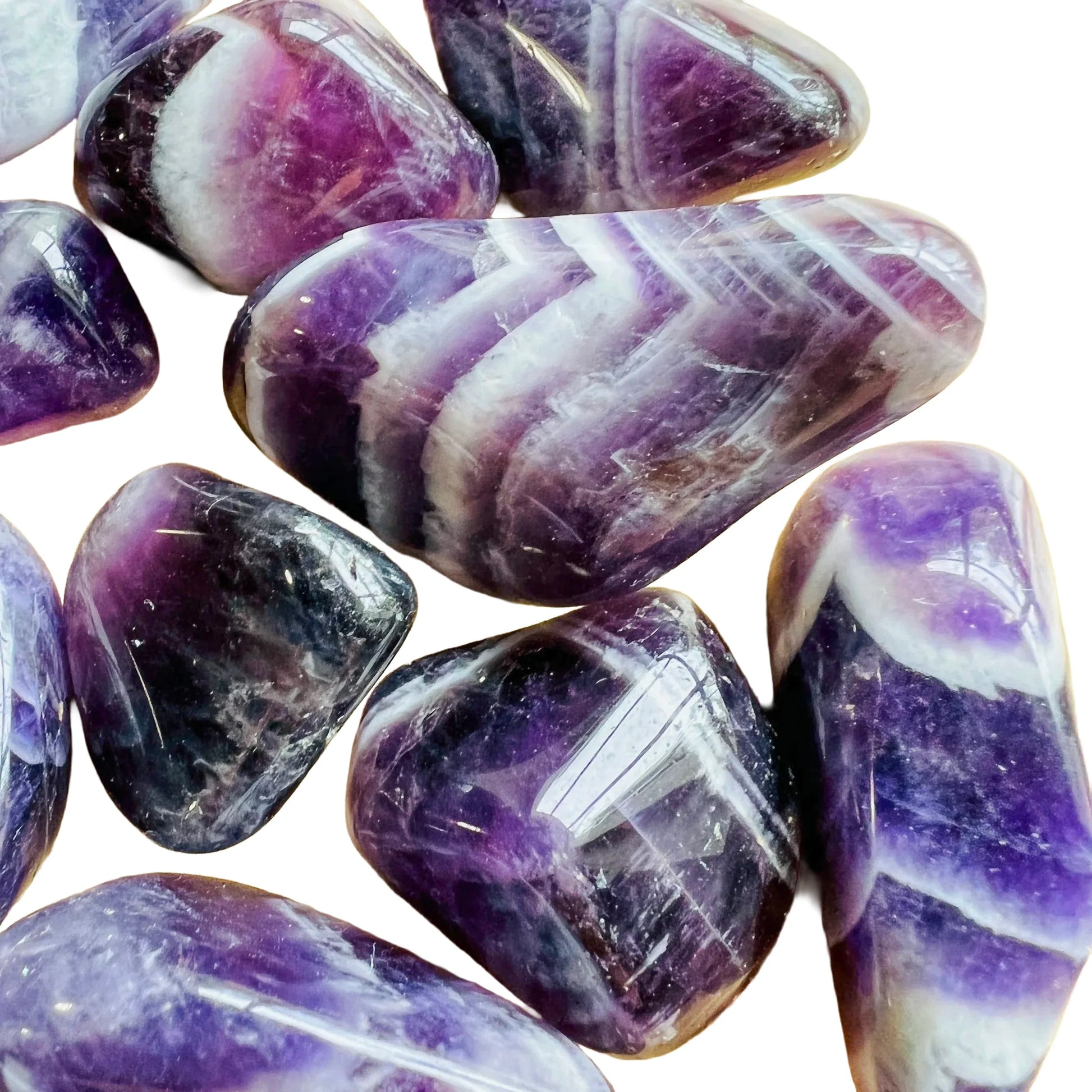 Top view of Chevron Amethyst tumbled stone, showing characteristic color.