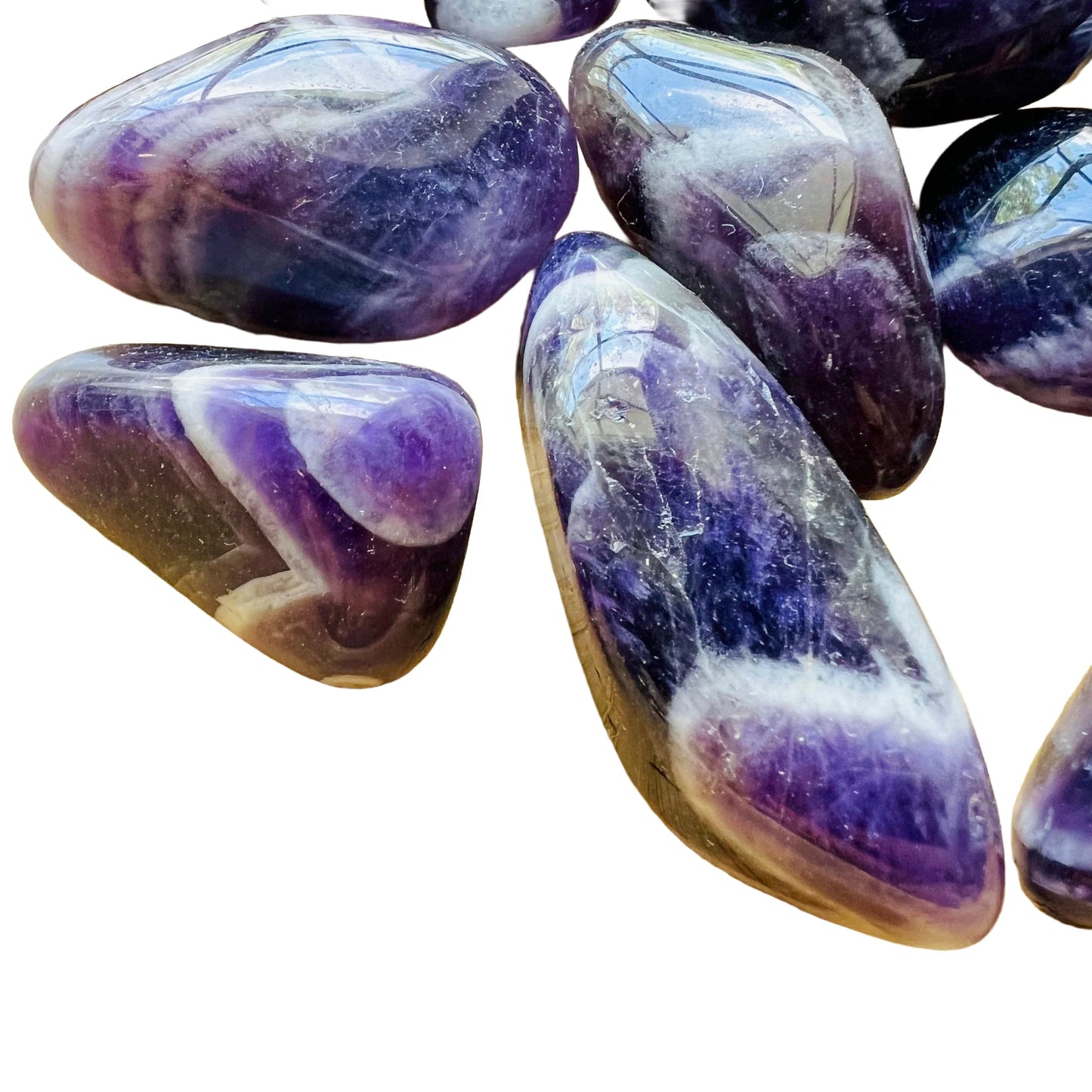 Magnified detail of purple Chevron Amethyst tumbled stone, often worked with for Intuition, sourced from Copperbelt Province.