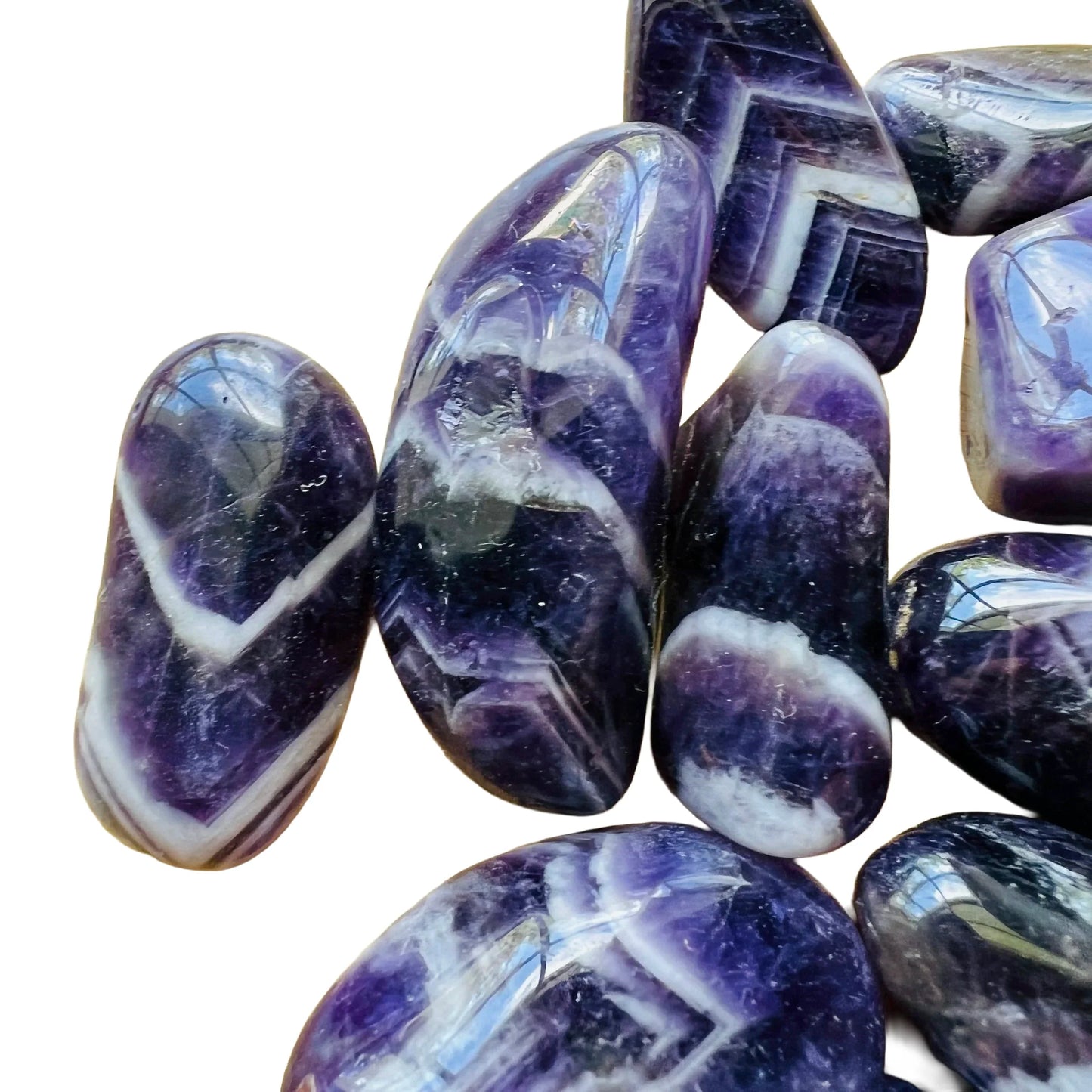 Lateral view of Chevron Amethyst tumbled stone, to support Intuition, showing characteristic color.