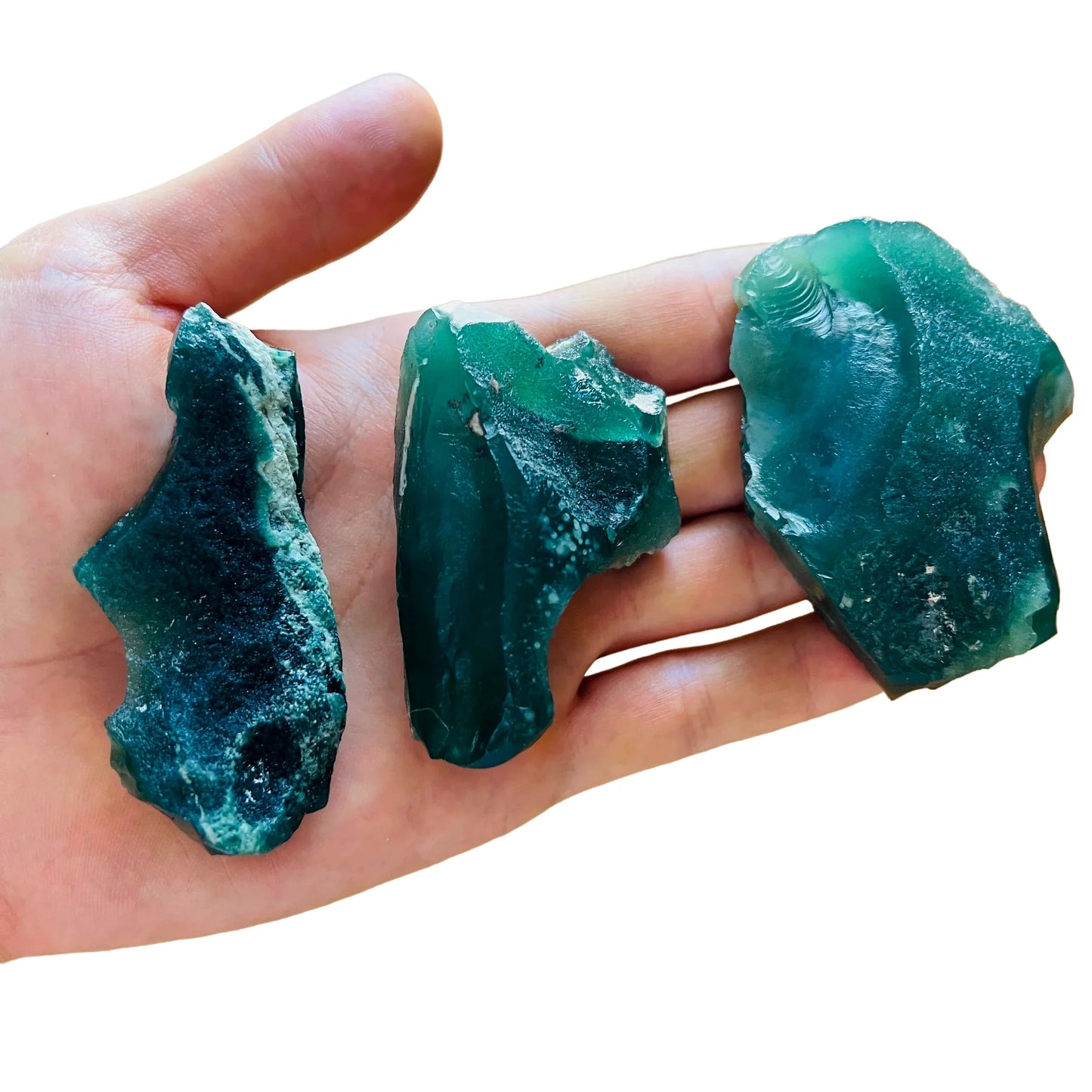 Grade a chalcedony raw held in hand for size reference