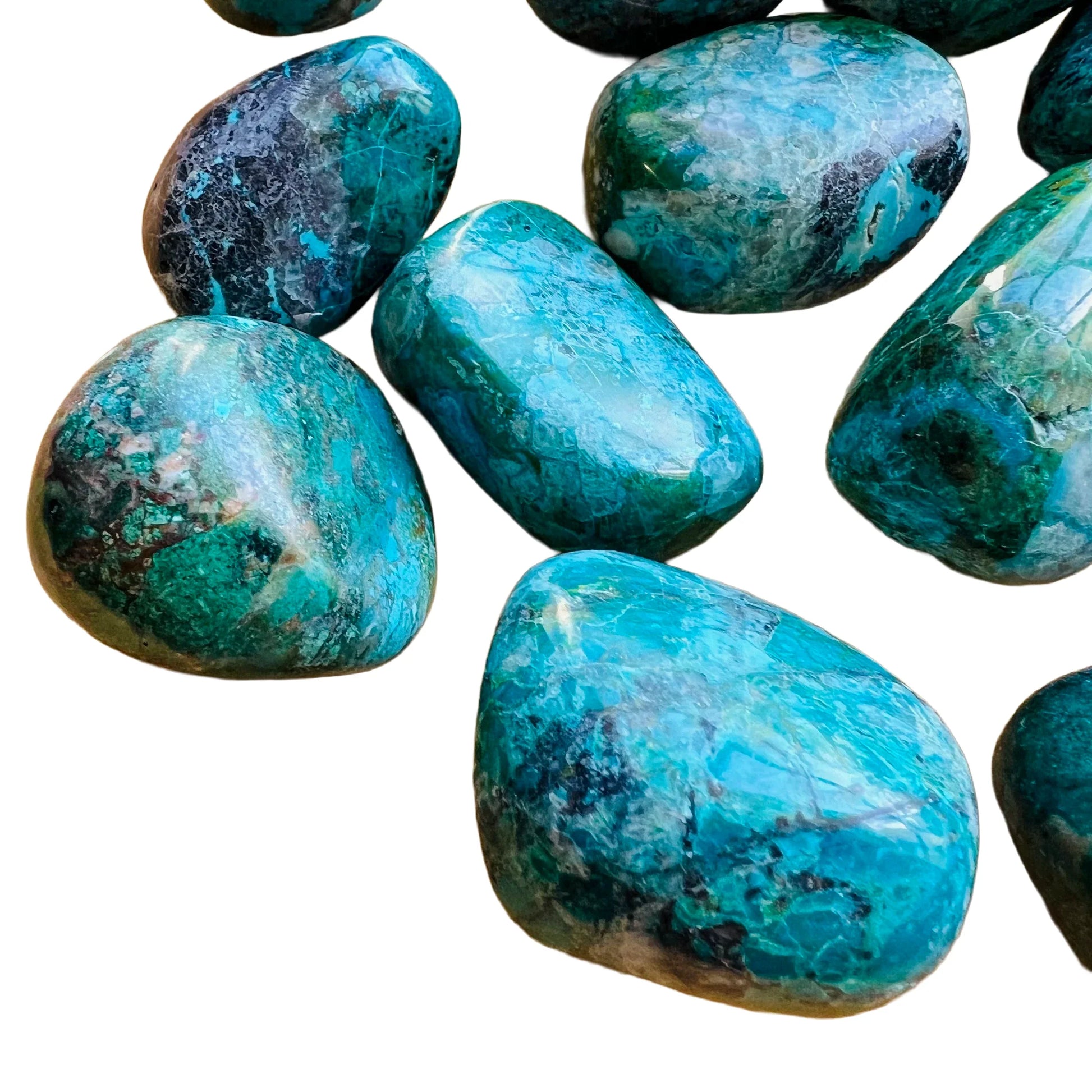 Top-down shot of Chrysocolla tumbled stone, showing earthy tone, sourced from Arequipa, Peru.