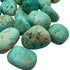 Edge-on view of Chrysocolla tumbled stone, showing subtle veining.