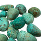 Rear view of Grade A Chrysocolla tumbled stone, sourced from Arequipa, Peru.