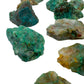 Underside view of Grade A Chrysocolla raw stone, showing honest grain, often paired with practices around Emotional Healing.