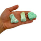 Styled with natural light Chrysoprase raw stone, with surface texture in view.