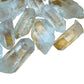 Macro view of Grade AA Clear Quartz raw point, carried for Cleansing and Meditation.