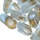 Side profile of Clear Quartz raw point, showing subtle veining, to support Cleansing.