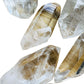 Side perspective of Clear Quartz raw point, sourced from United States, showing natural sheen.