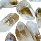 Alternate side of Clear Quartz raw point, showing natural texture.