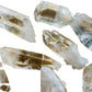 Three-quarter view of Clear Quartz raw crystal, from Arkansas, United States, associated with Healing, shown in a calm studio setting.