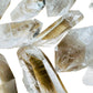 Back view of Grade AAA Clear Quartz point showing natural surface