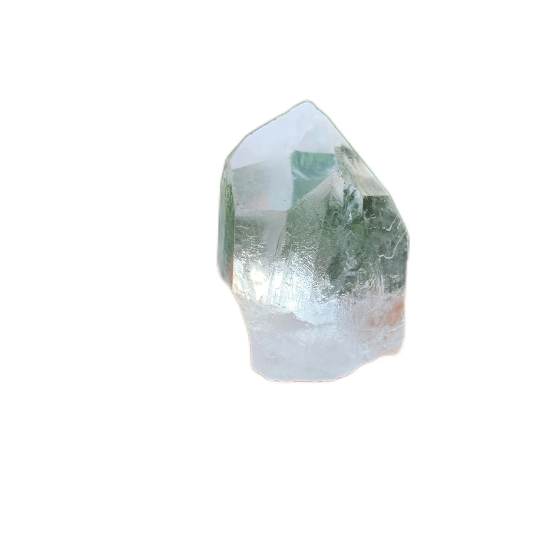 Sideways view of Grade A Clear Quartz raw point, often worked with for Cleansing, from Minas Gerais, Brazil.