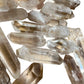 Alternate angle of Clear Quartz raw point, sourced from Alaotra-Mangoro, Madagascar, showing characteristic color.