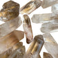 Back view of Grade A Clear Quartz point showing natural surface