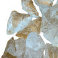 Back view of Grade AA Clear Quartz raw showing natural surface