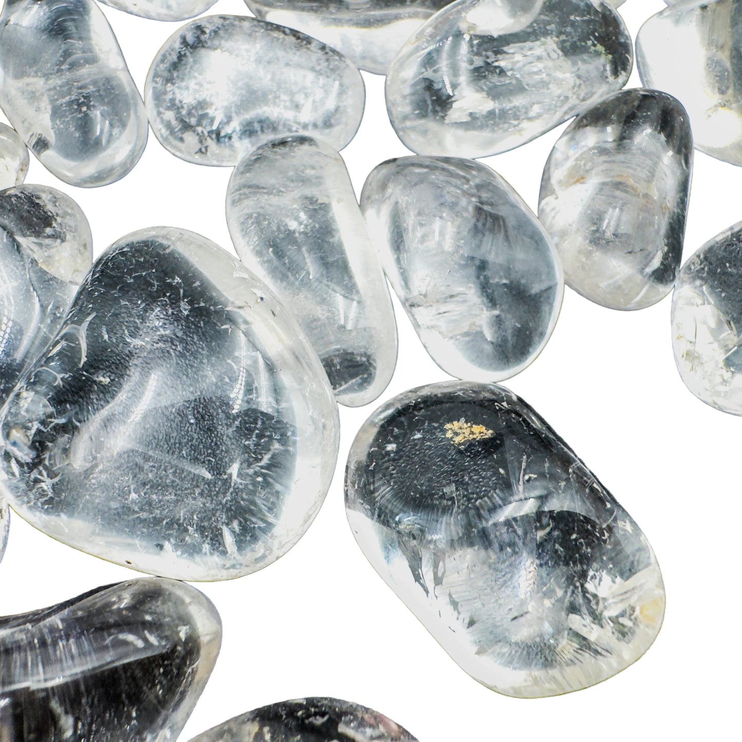Detail of Grade AAA Clear Quartz tumbled stones with visible internal clarity, ethically sourced Minas Gerais, Brazil