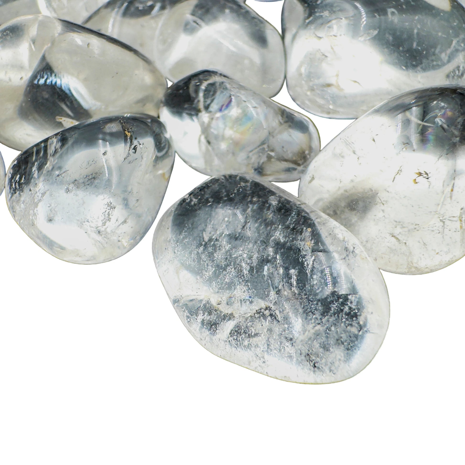 Side view of Clear Quartz tumbled stones showing deep crystalline clarity, hand-polished AAA grade from Minas Gerais