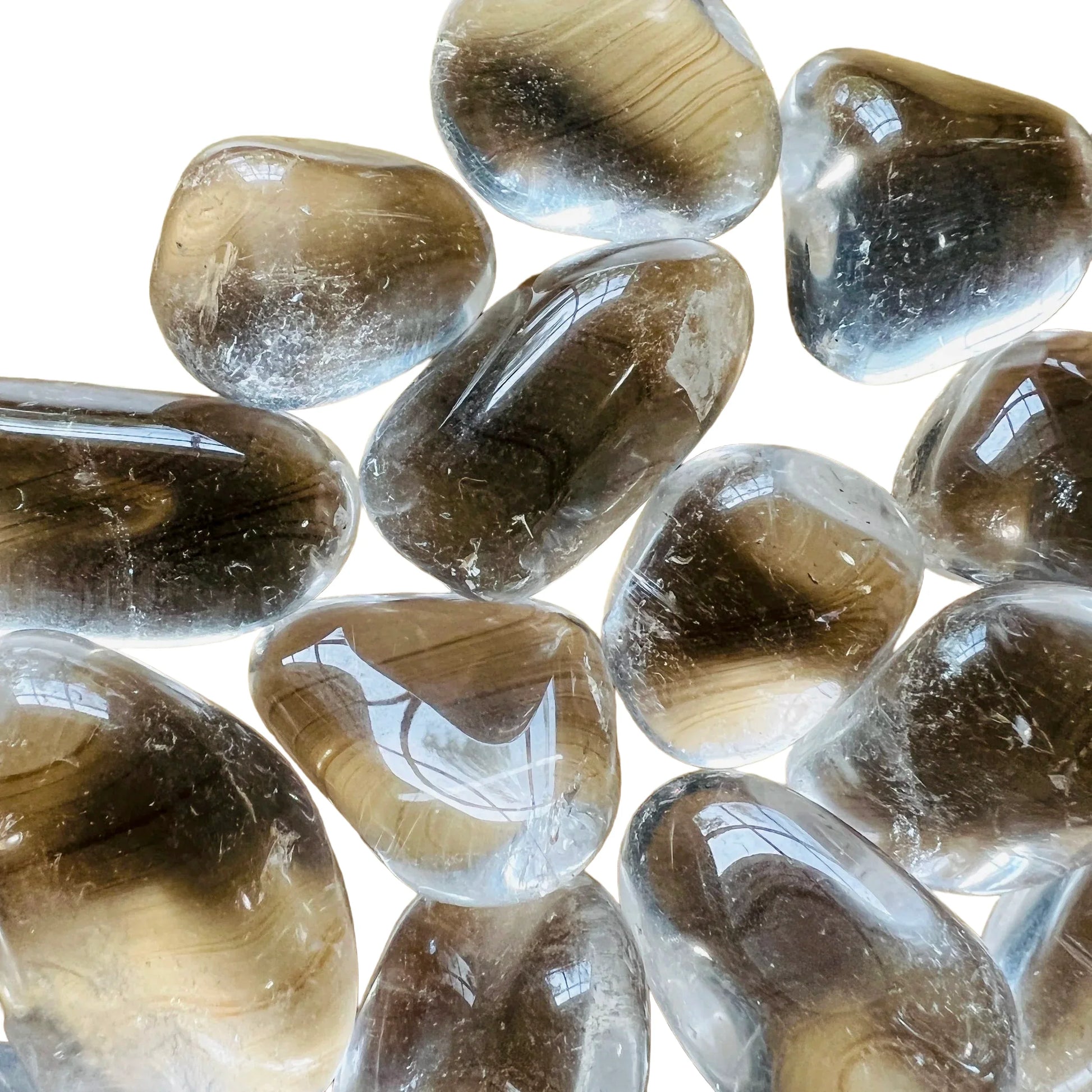 Top-down shot of Clear Quartz tumbled stone, hand-selected from Minas Gerais, Brazil, showing matte finish.