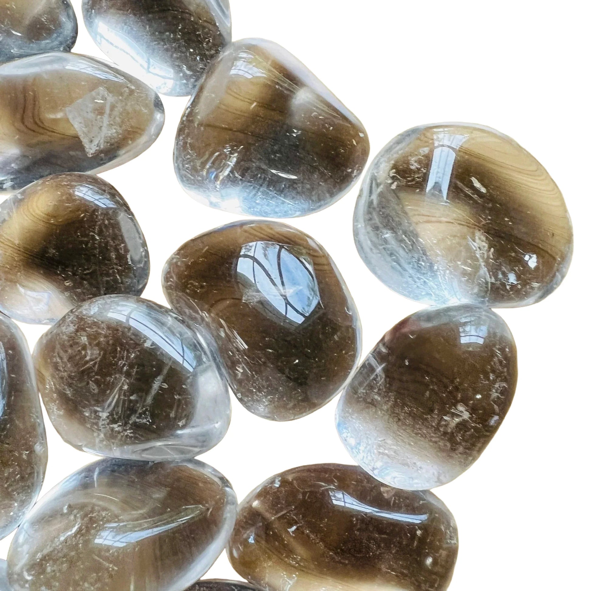 Palm-scale view of one Clear Quartz tumbled stone for scale, hand-selected from Minas Gerais, Brazil.