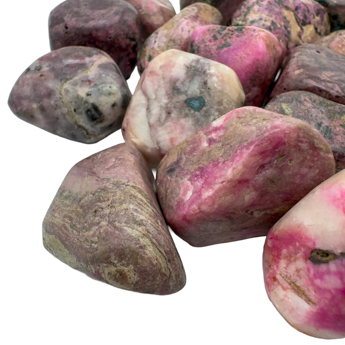 Color detail of Cobalt Calcite tumbled stone, showing natural variation, sourced from Democratic Republic of the Congo.