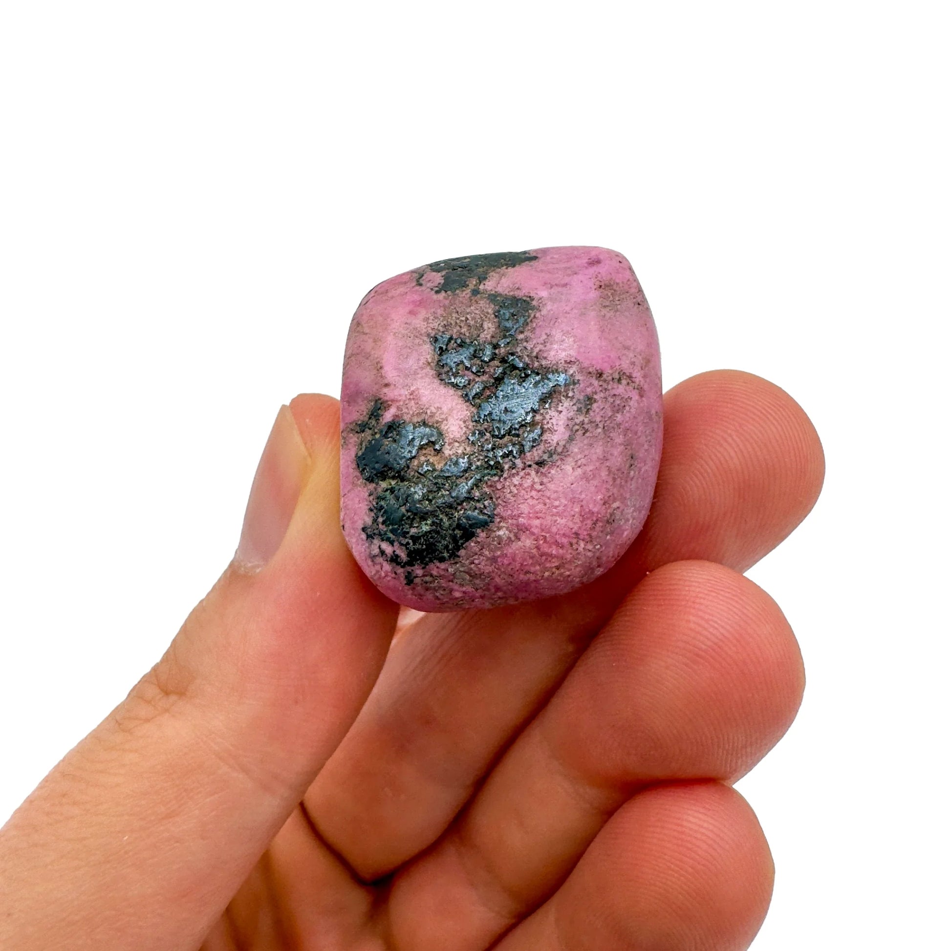 Palm-scale view of one Cobalt Calcite tumbled stone for scale, hand-selected from Haut-Lomami, Democratic Republic of the Congo.