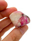 Back view of Grade A Cobalt Calcite tumbled stone showing natural surface
